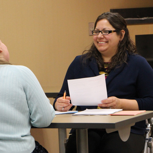 Human Resources Industry photo - a woman interviews another person for a job