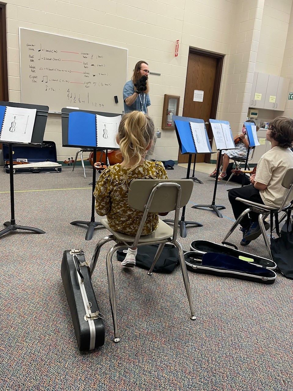 Christina's daughter in her second year of violin classes at the Flint Institute of Music